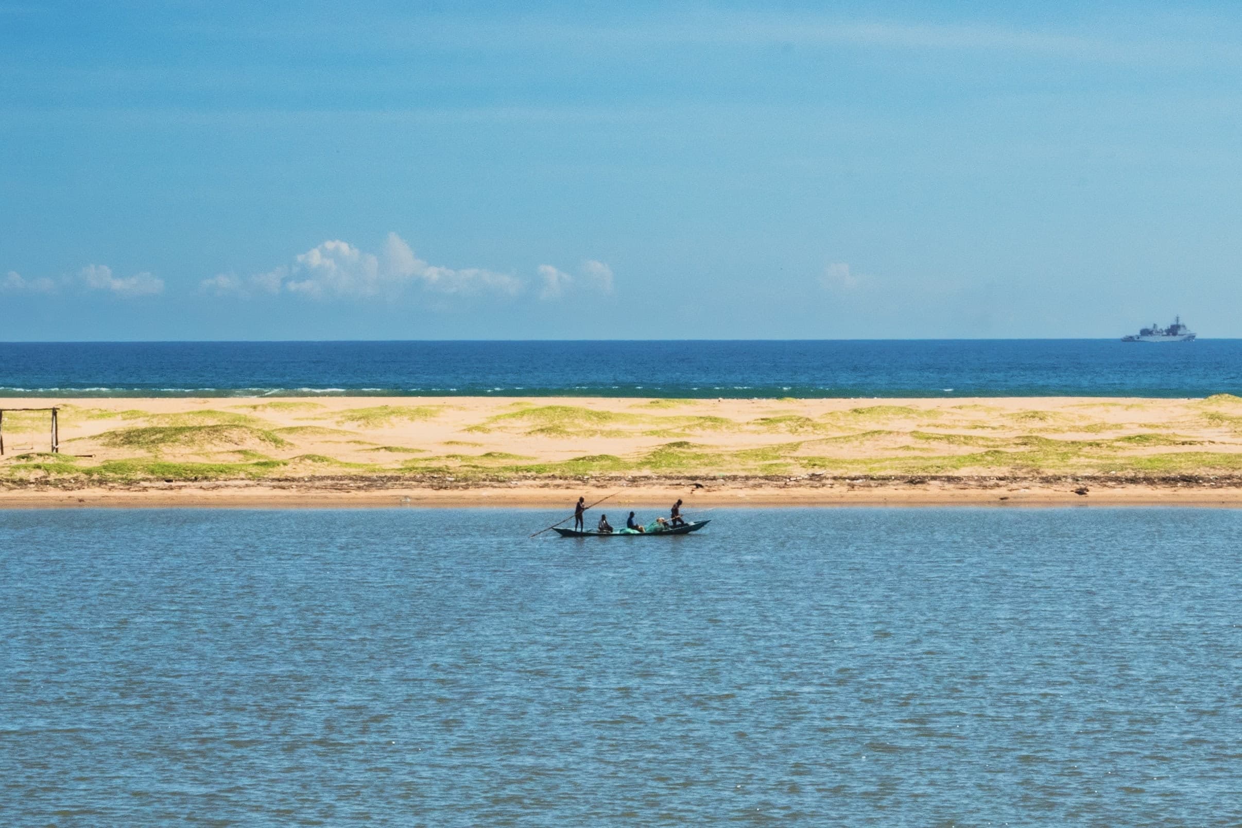A river separated from the sea by a strip of sand